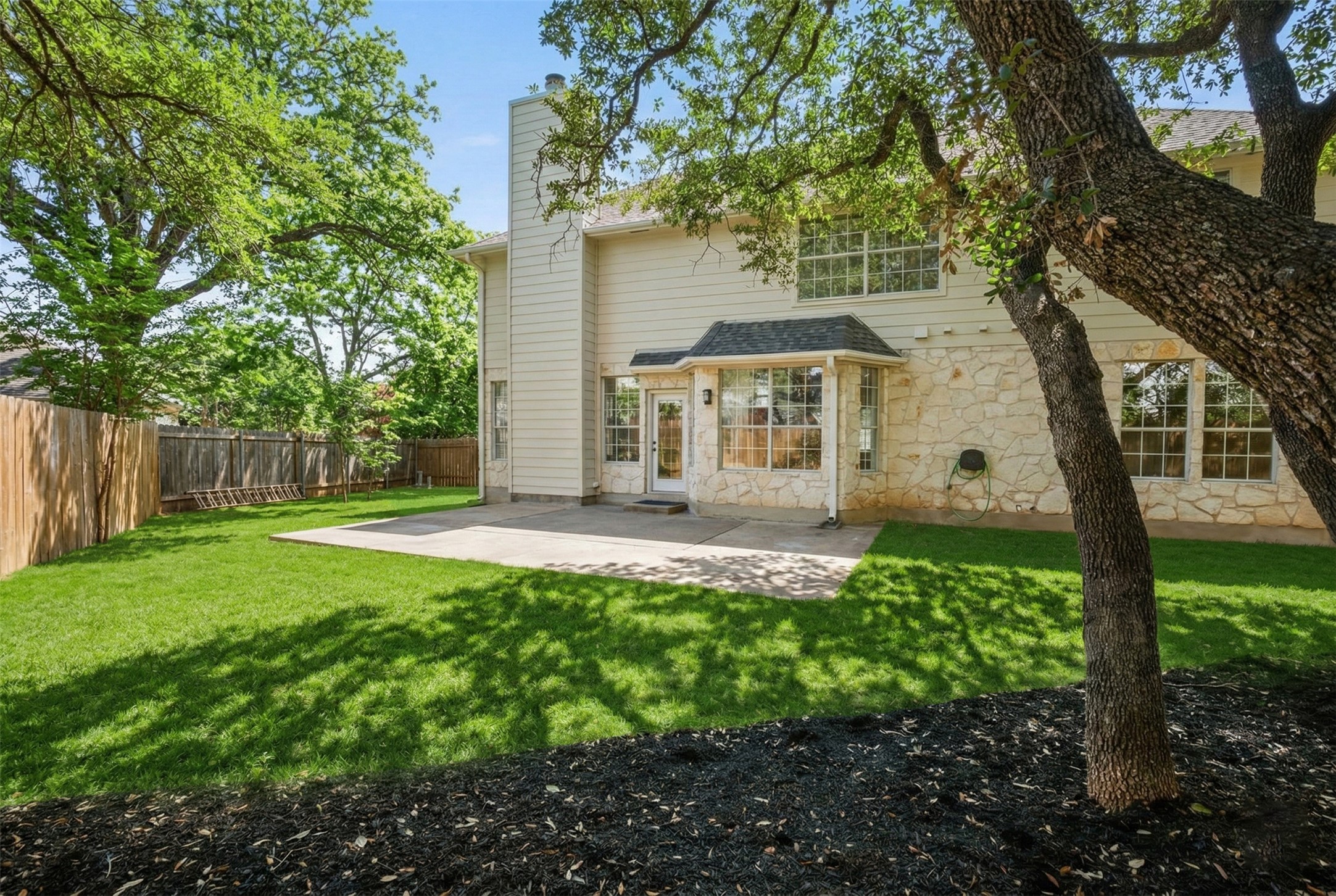 2022 Inverness Drive Round Rock, TX 78681 - Photo 35 of 38 a front view of a house with garden