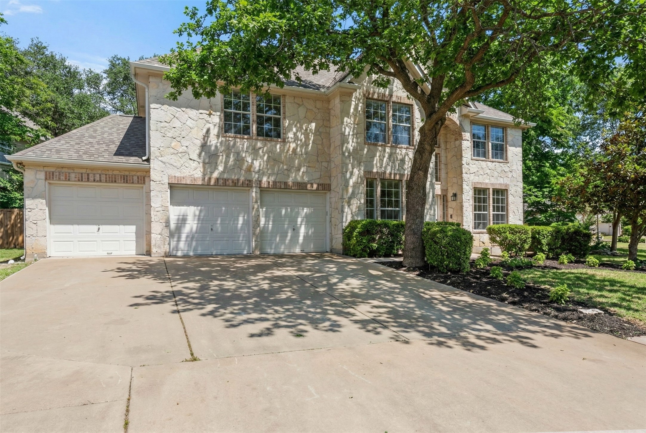 2022 Inverness Drive Round Rock, TX 78681 - Photo 37 of 38 a front view of a house with a yard and garage