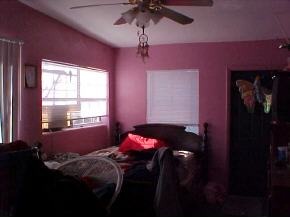 1066 Cable Palm Bay, FL 32905 - Photo 5 of 6 a bedroom with a bed and a window
