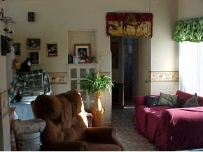 1066 Cable Palm Bay, FL 32905 - Photo 6 of 6 a living room with furniture a potted plant and a window