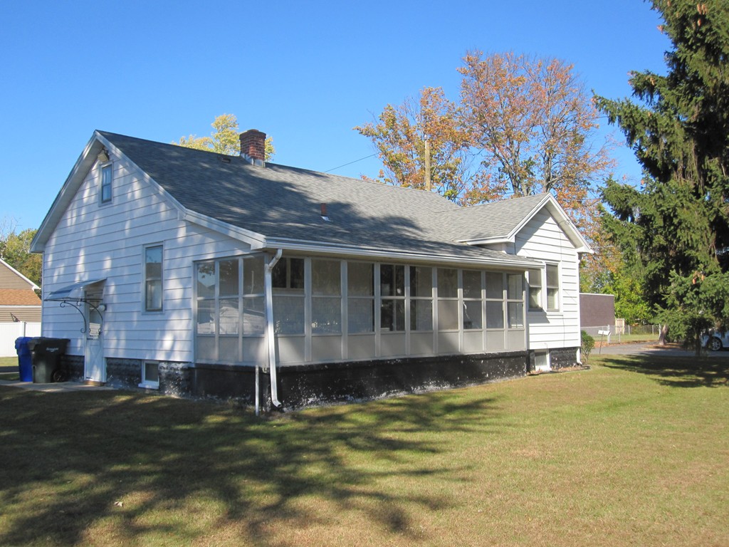 19 Nichols Street Springfield, MA 01151 - Photo 2 of 13 a front view of a house with a yard