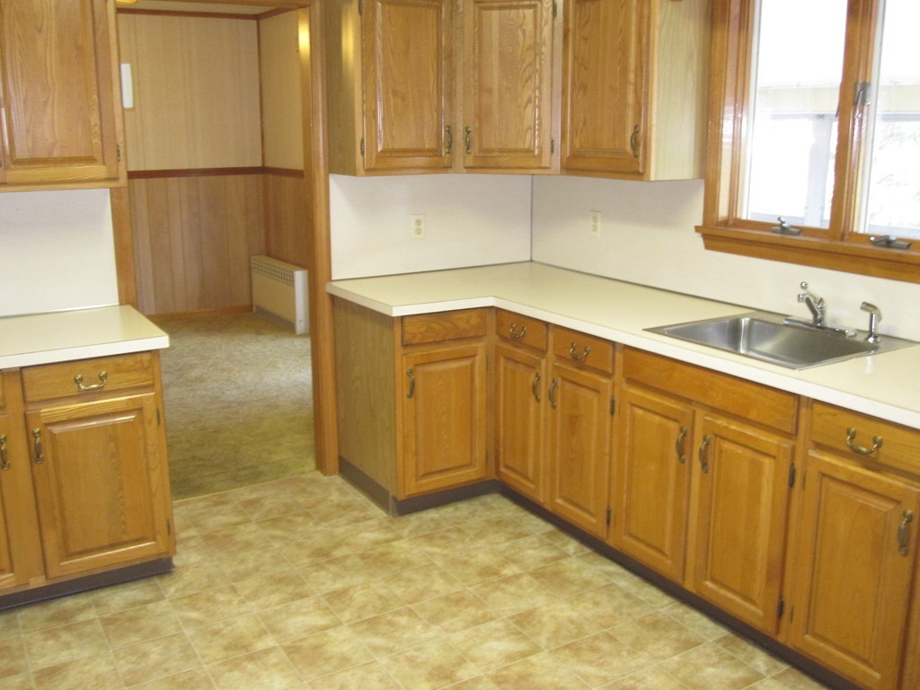 19 Nichols Street Springfield, MA 01151 - Photo 7 of 13 a view of a kitchen with wooden cabinets