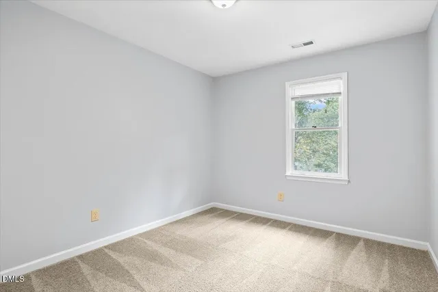 an empty room with a natural light