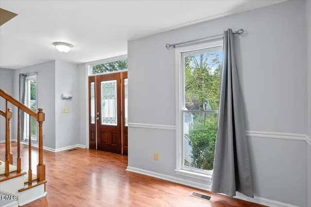 a view of an entryway with wooden floor
