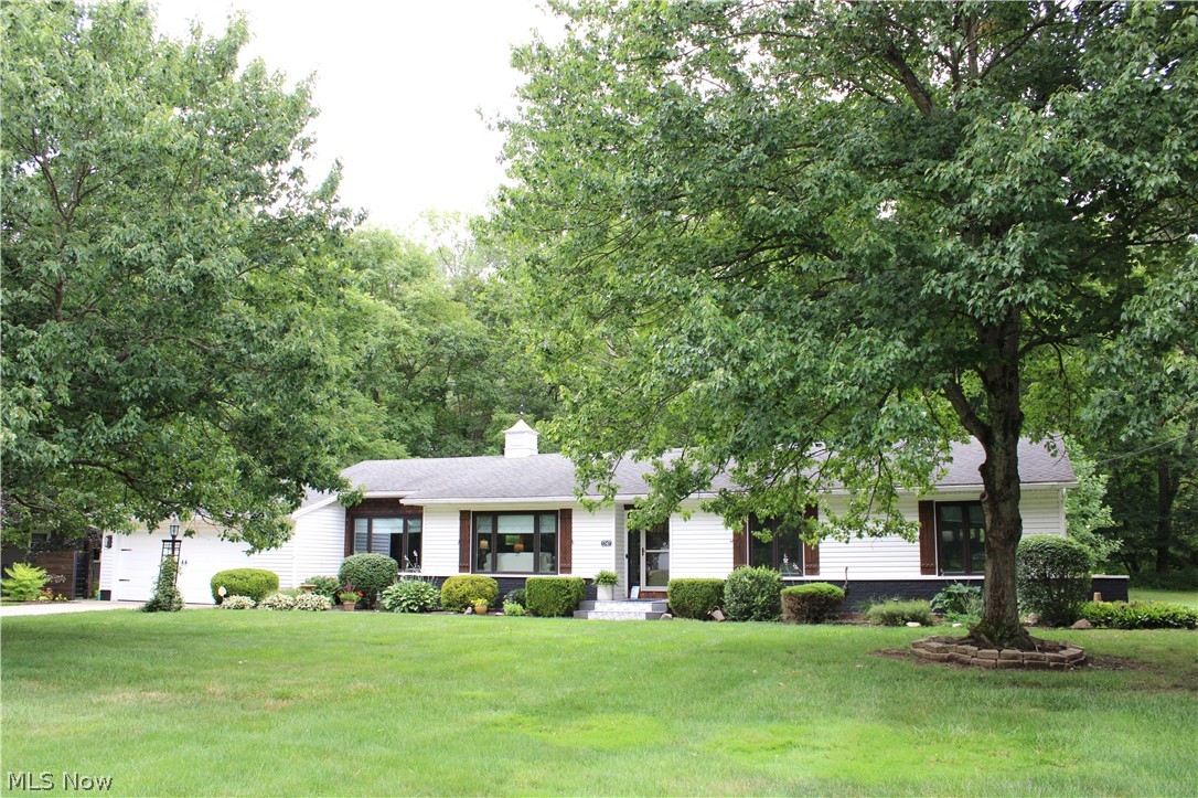 5547 River Styx Road Medina, OH 44256 - Photo 1 of 45 White ranch-style home featuring a shingled roof, dark window frames, and brown shutters