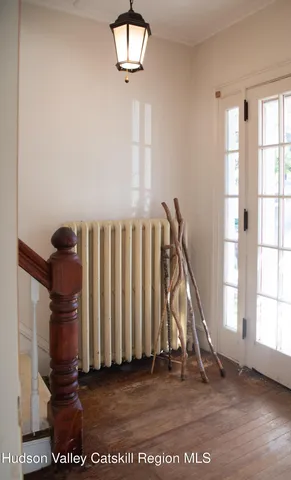 an entryway in a hall with a window