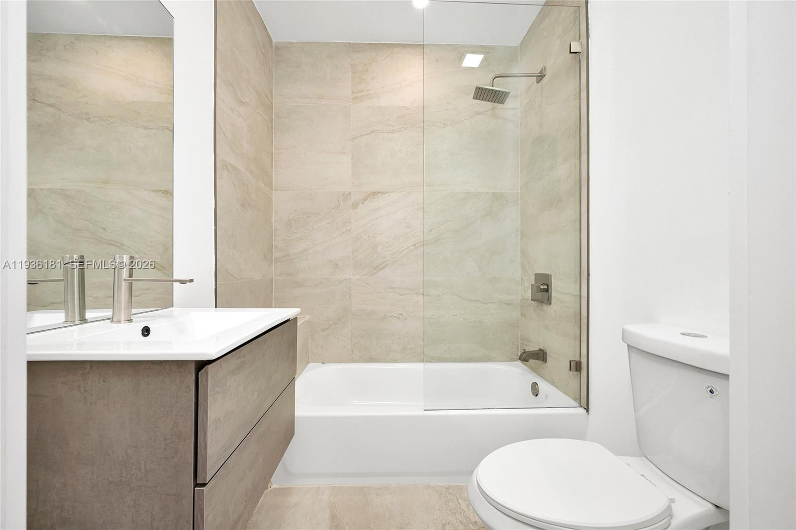 1511 Southwest 20th Court Miami, FL 33145 - Photo 17 of 41 a bathroom with a sink toilet and shower