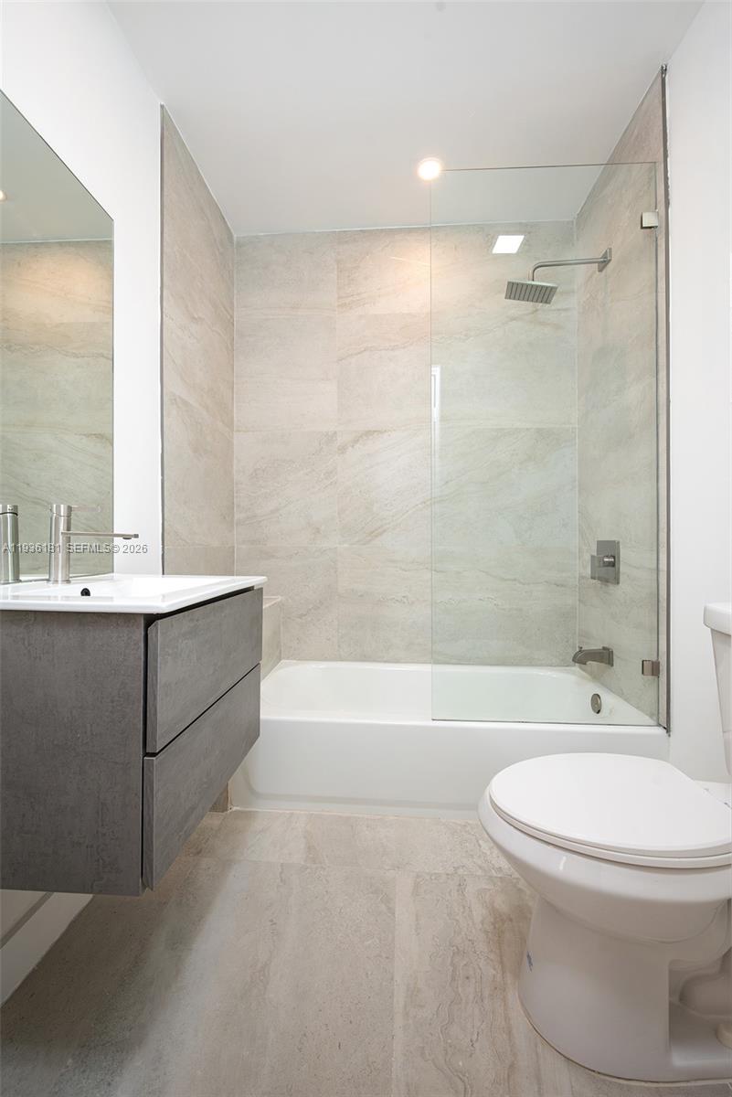 1511 Southwest 20th Court Miami, FL 33145 - Photo 18 of 41 a bathroom with a bathtub shower sink mirror and toilet