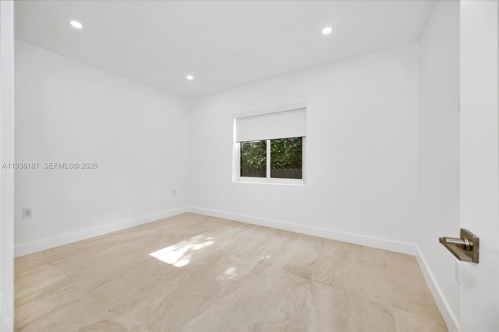 1511 Southwest 20th Court Miami, FL 33145 - Photo 19 of 41 an empty room with a window