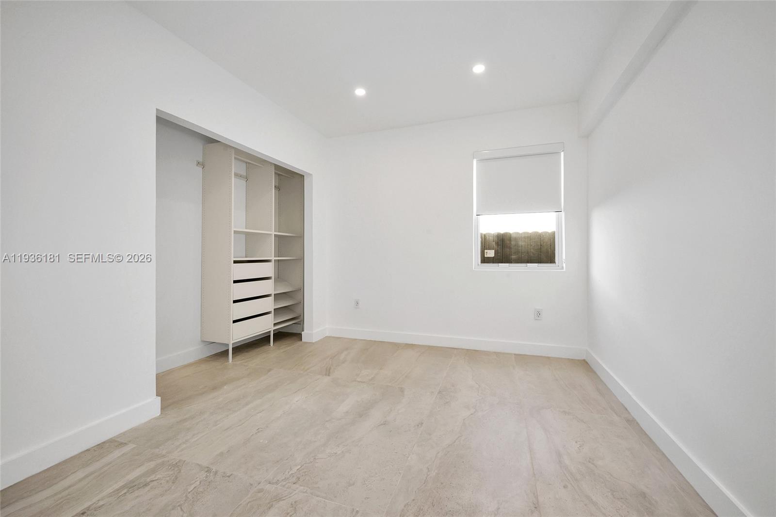 1511 Southwest 20th Court Miami, FL 33145 - Photo 22 of 41 an empty room with furniture and natural light