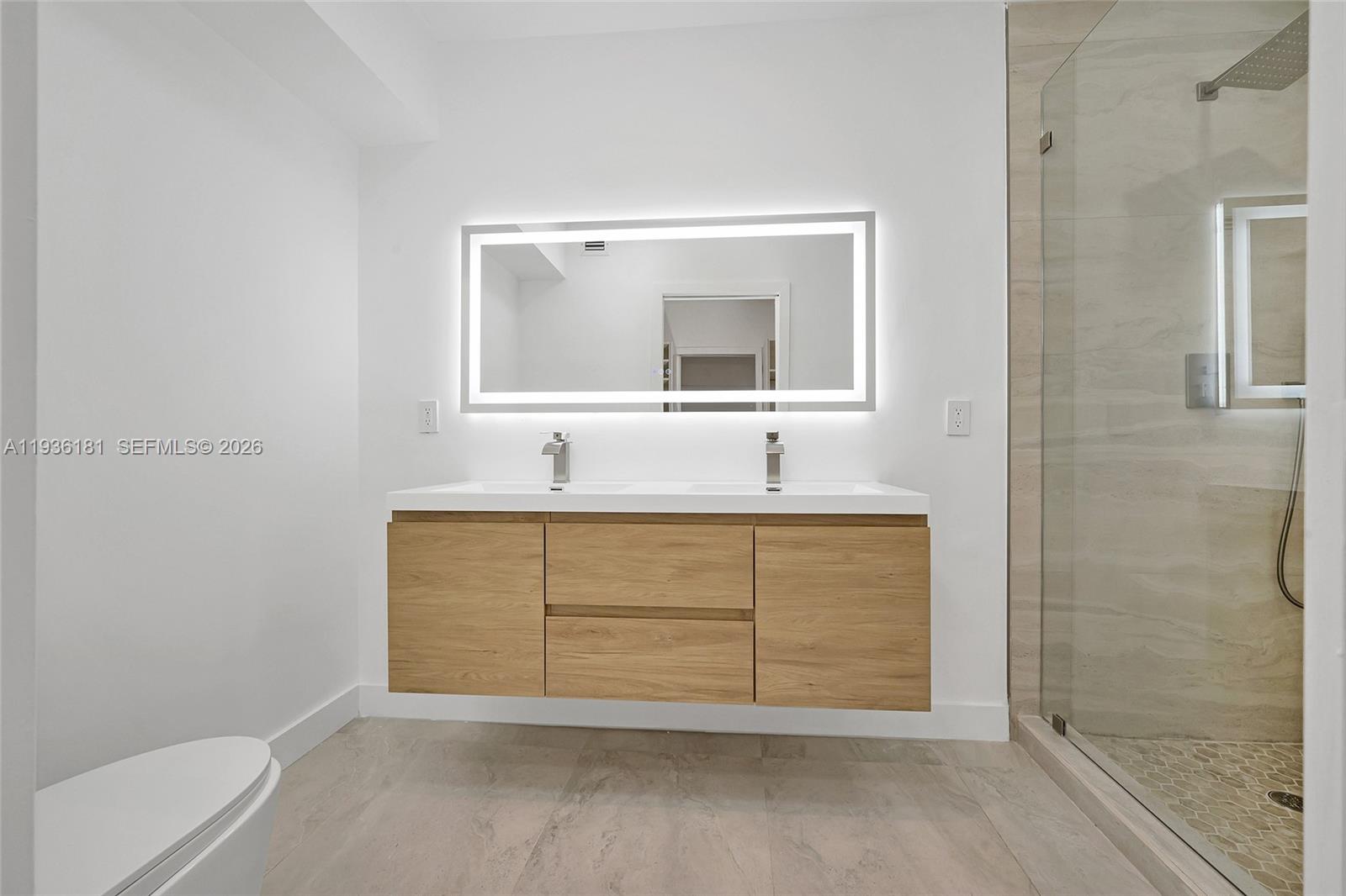 1511 Southwest 20th Court Miami, FL 33145 - Photo 32 of 41 a bathroom with a sink and a mirror