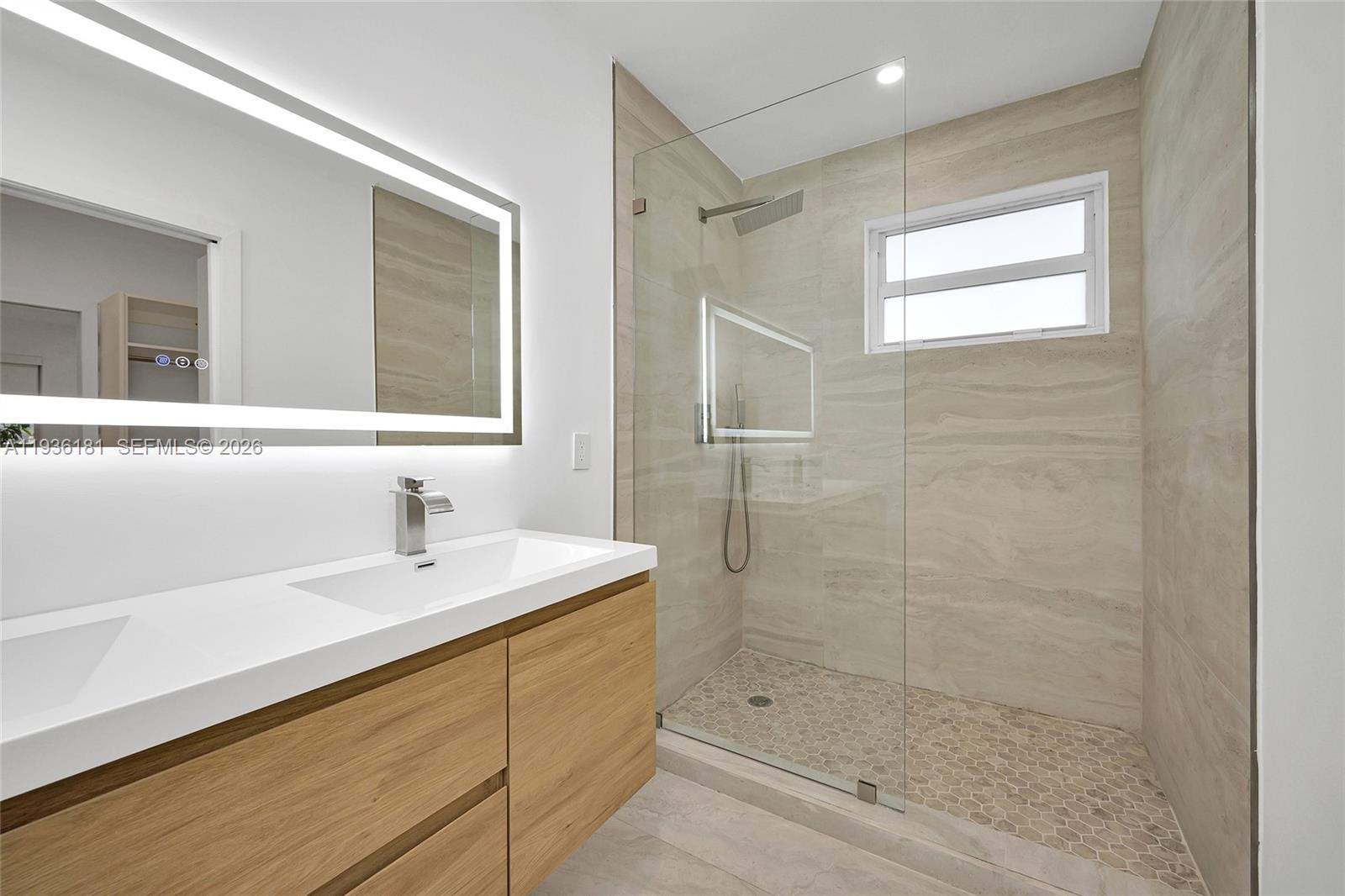 1511 Southwest 20th Court Miami, FL 33145 - Photo 33 of 41 a bathroom with a shower sink and mirror