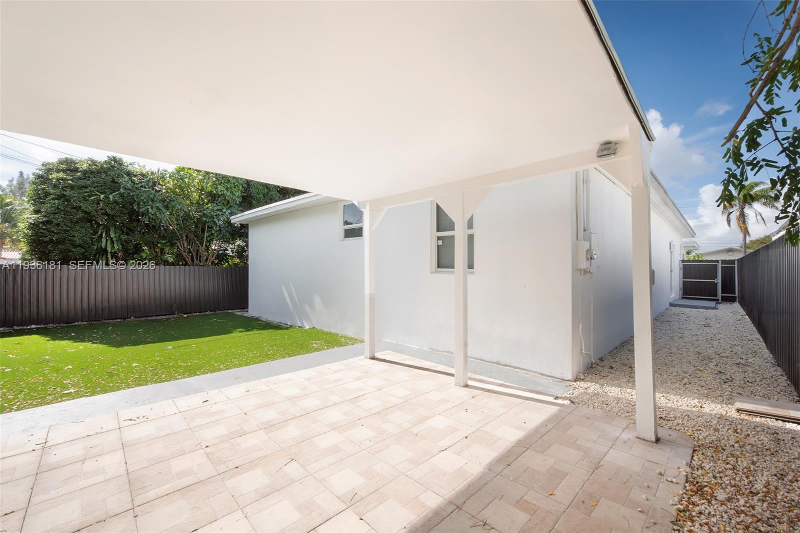1511 Southwest 20th Court Miami, FL 33145 - Photo 37 of 41 a backyard of a house with garden and garage