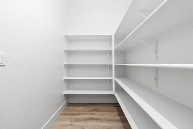 a spacious bathroom with a sink and a mirror