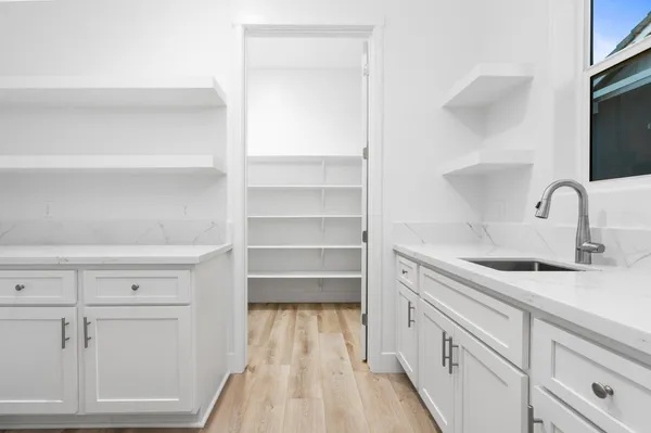 a kitchen with cabinets and a sink