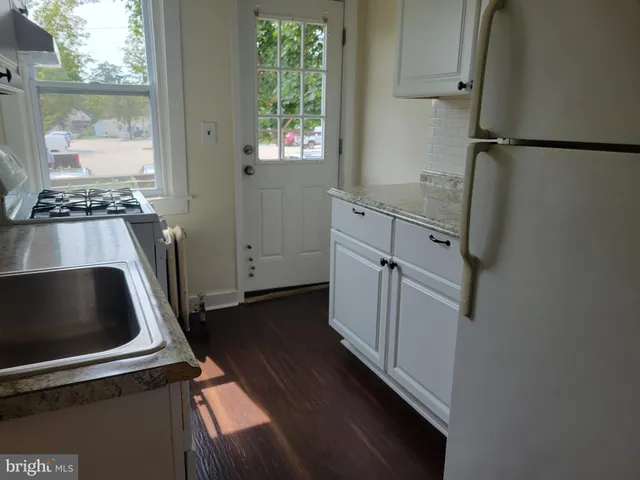 a view of kitchen and utility room