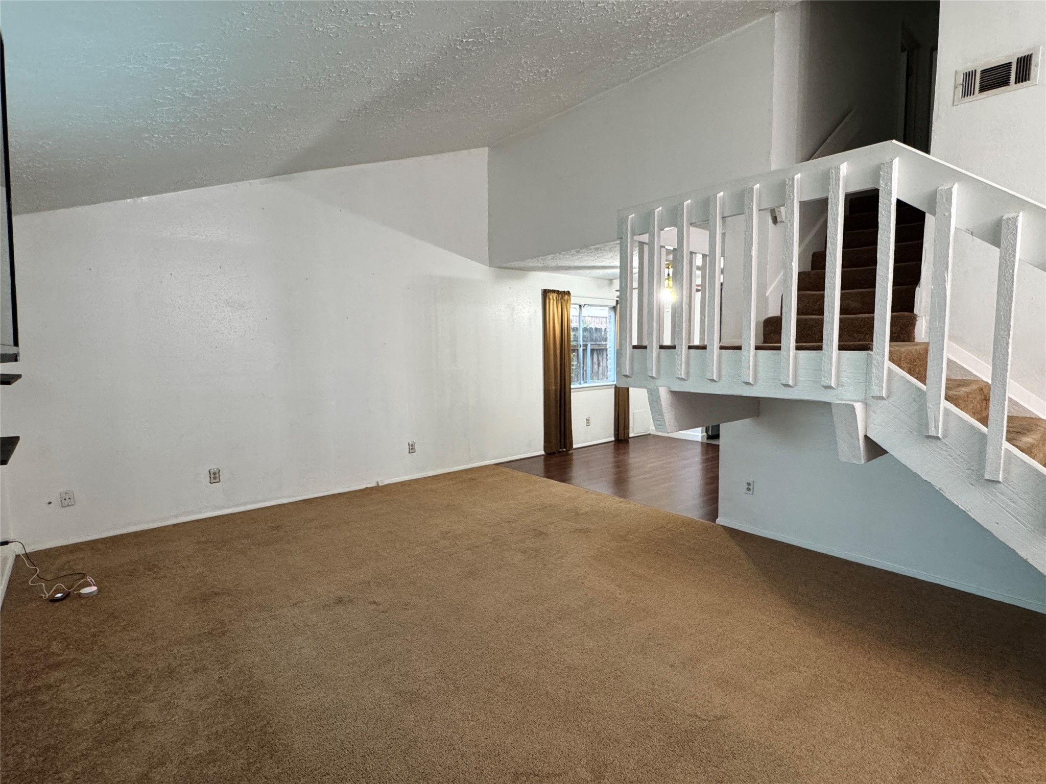 8519 Church Light Lane Houston, TX 77064 - Photo 18 of 24 a view of an empty room with stairs