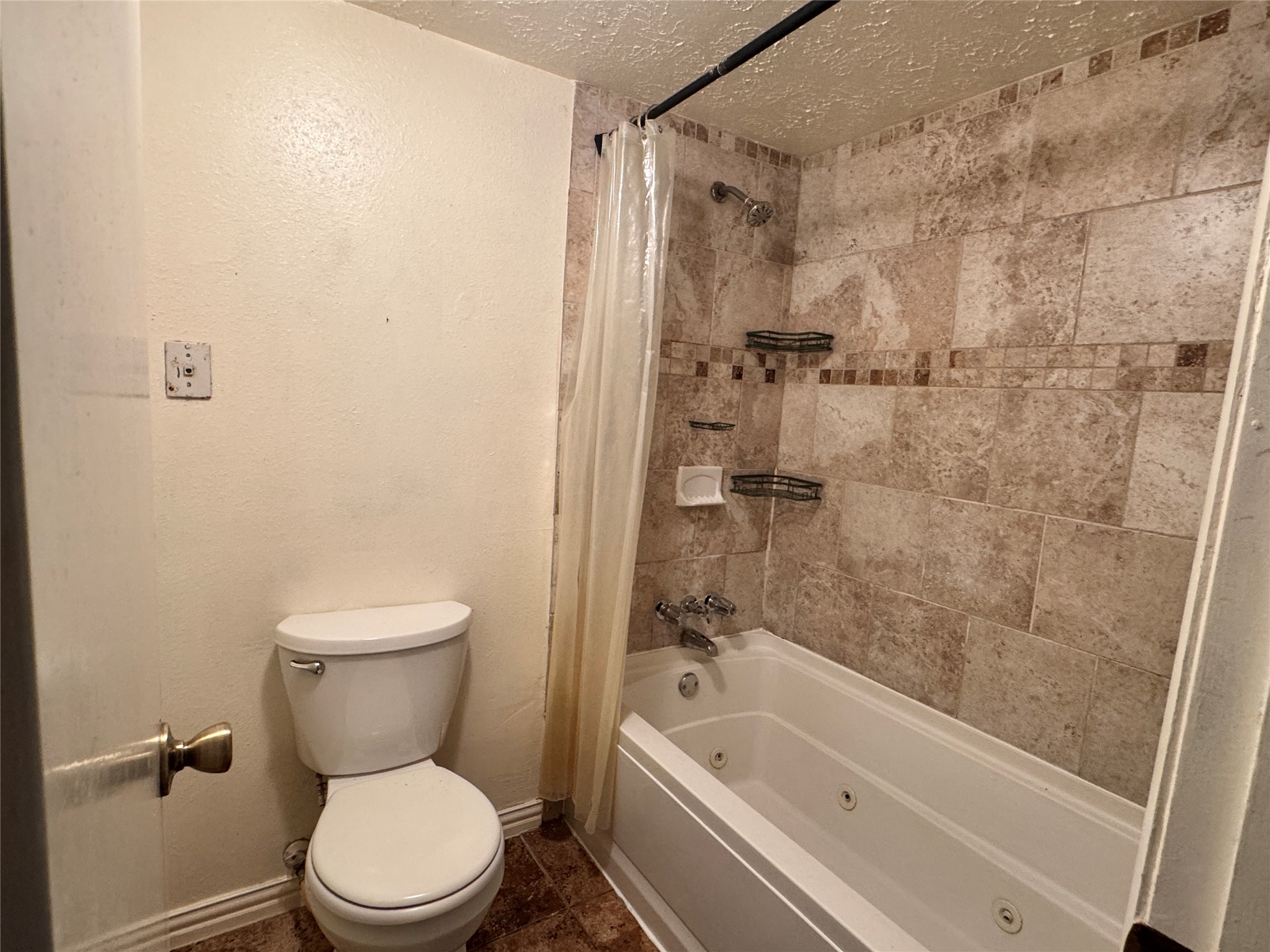 8519 Church Light Lane Houston, TX 77064 - Photo 22 of 24 a white toilet sitting next to a bath tub and a shower
