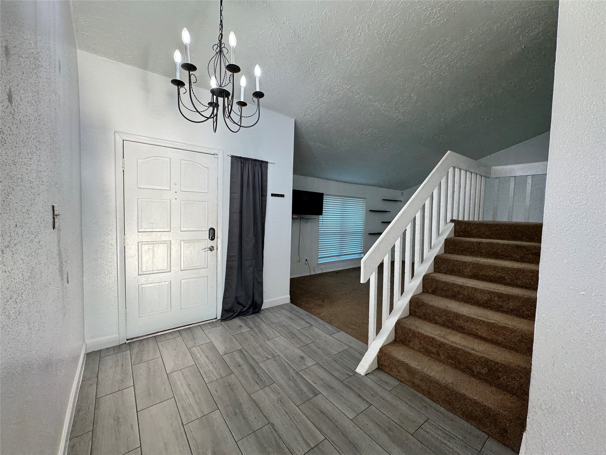 8519 Church Light Lane Houston, TX 77064 - Photo 5 of 24 a view of an entryway with wooden floor