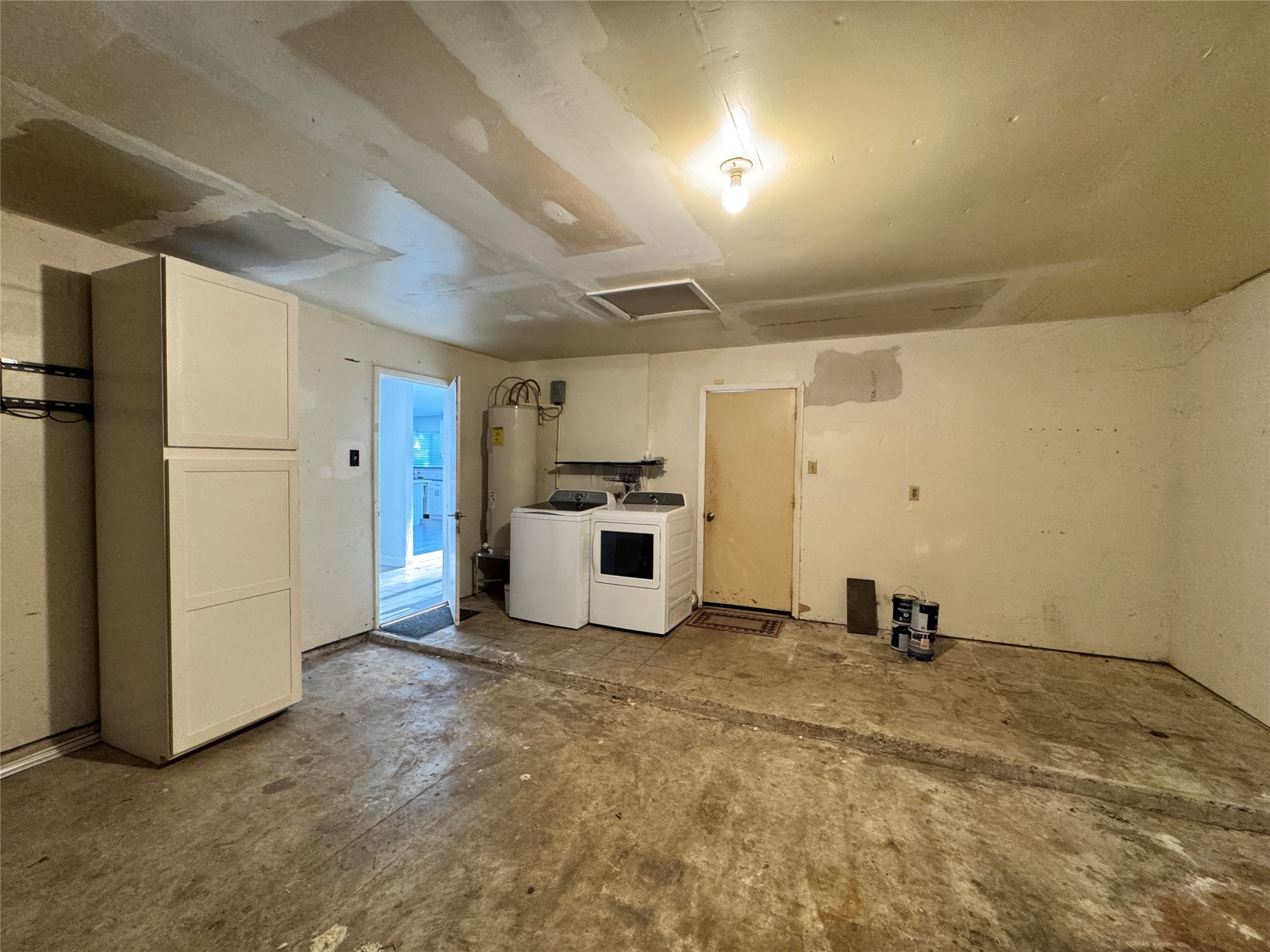 8519 Church Light Lane Houston, TX 77064 - Photo 6 of 24 a view of a kitchen with refrigerator and white cabinets