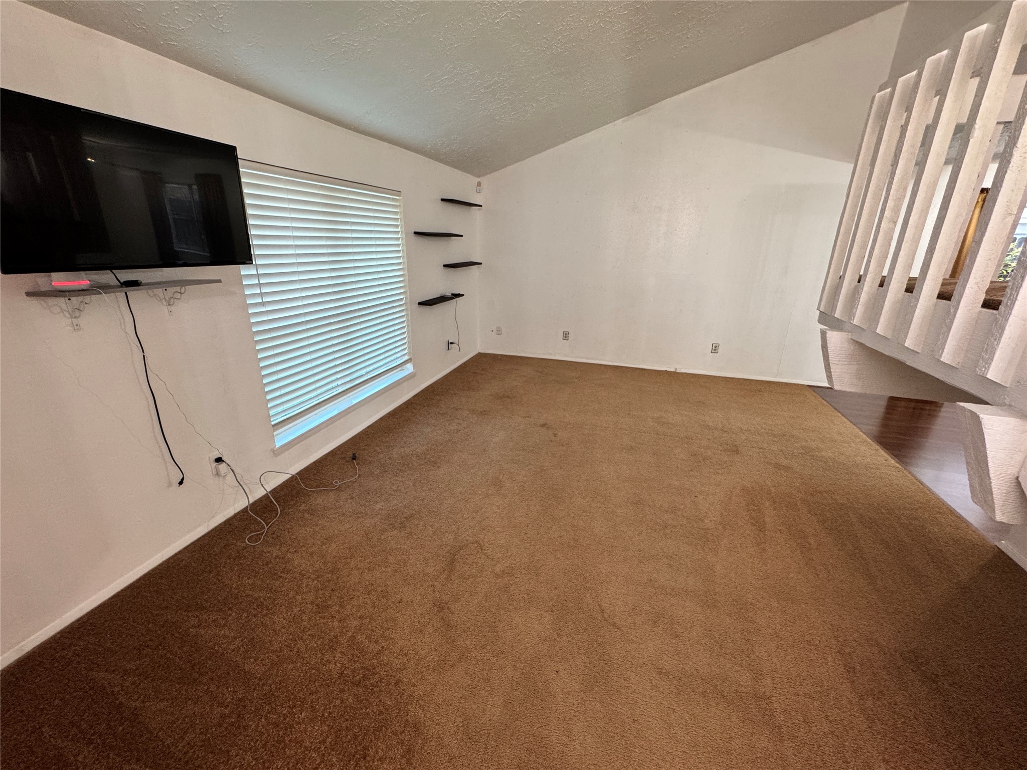8519 Church Light Lane Houston, TX 77064 - Photo 10 of 24 a view of a livingroom with an empty space and a couch