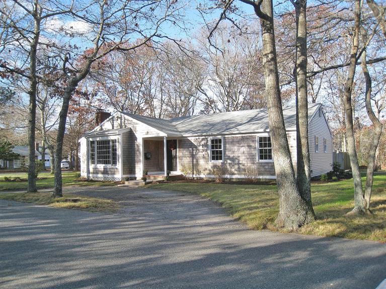6 Fox Hill Road Centerville, MA 02632 - Photo 14 of 21 a front view of a house with a yard