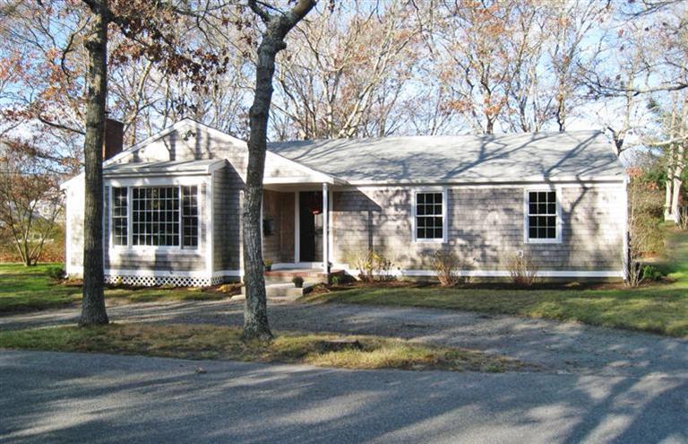 6 Fox Hill Road Centerville, MA 02632 - Photo 15 of 21 a front view of a house with a yard