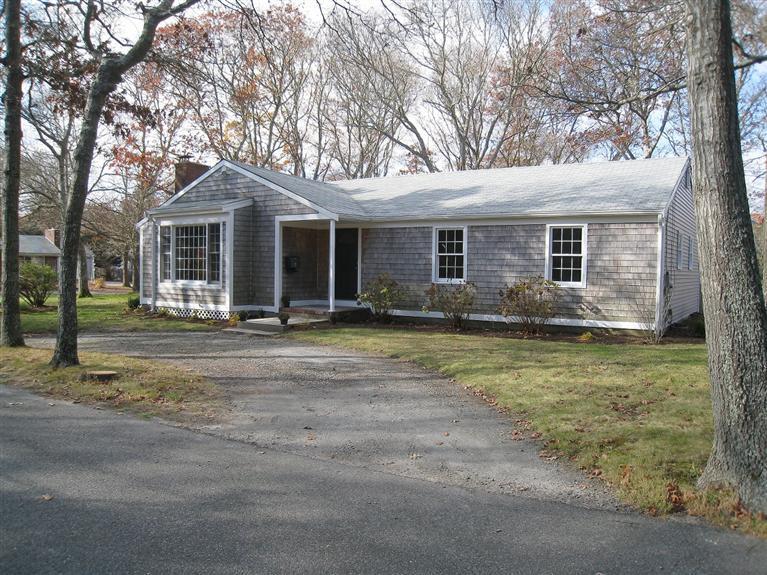 6 Fox Hill Road Centerville, MA 02632 - Photo 21 of 21 a front view of house with yard and trees around