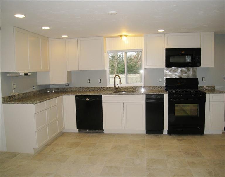 6 Fox Hill Road Centerville, MA 02632 - Photo 3 of 21 a kitchen with a sink stove and microwave