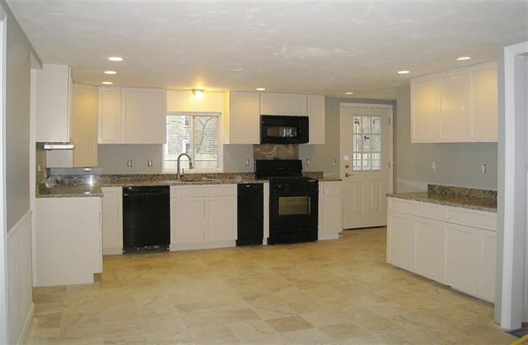 6 Fox Hill Road Centerville, MA 02632 - Photo 4 of 21 a kitchen with stainless steel appliances granite countertop a stove a sink and a refrigerator