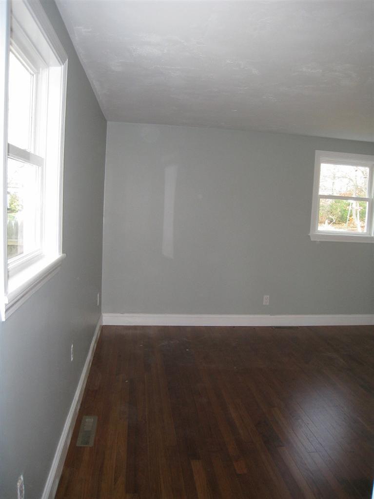 6 Fox Hill Road Centerville, MA 02632 - Photo 7 of 21 an empty room with wooden floor and windows