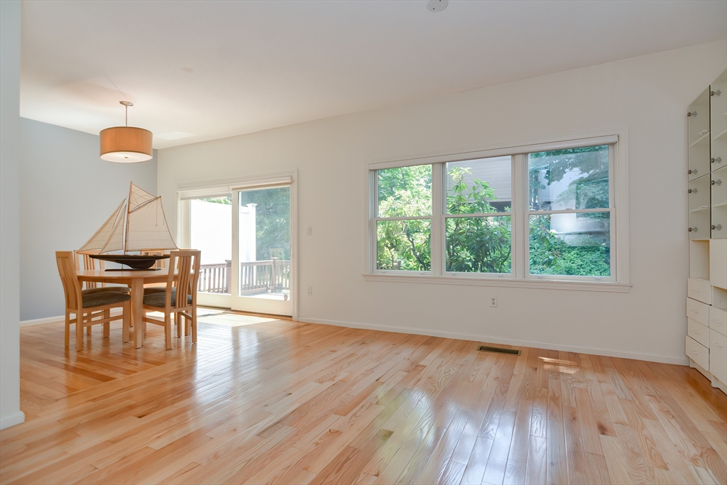 327 Bishops Forest Drive, Unit 327 Waltham, MA 02452 - Photo 18 of 38 a view of a livingroom with furniture window and wooden floor