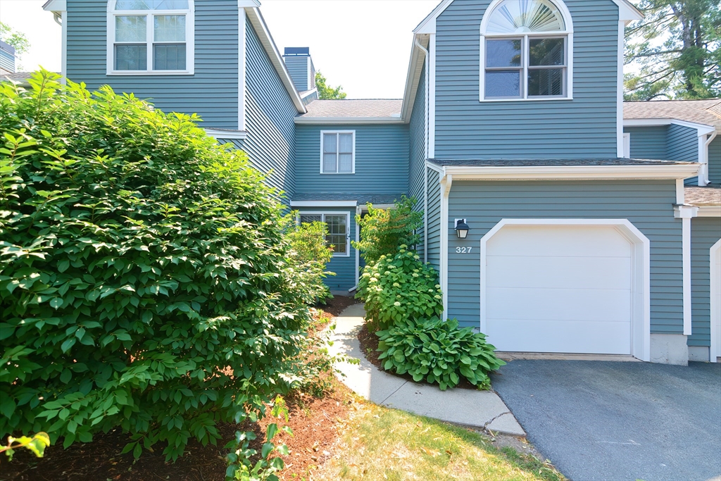 327 Bishops Forest Drive, Unit 327 Waltham, MA 02452 - Photo 2 of 38 a view of a house with potted plants