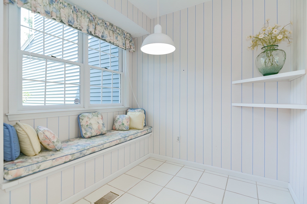 327 Bishops Forest Drive, Unit 327 Waltham, MA 02452 - Photo 5 of 38 a bathroom with a granite countertop sink and a mirror