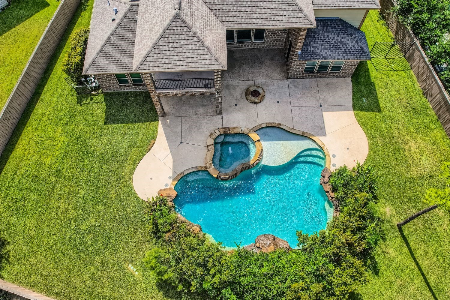 6 Freestone Stream Place The Woodlands, TX 77389 - Photo 2 of 50 an aerial view of a house with outdoor space
