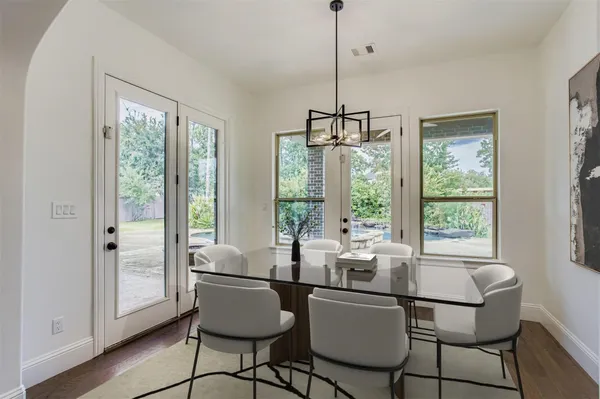 a dining room with furniture window wooden floor