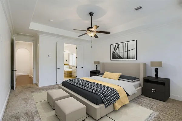 a bedroom with a bed and a chandelier