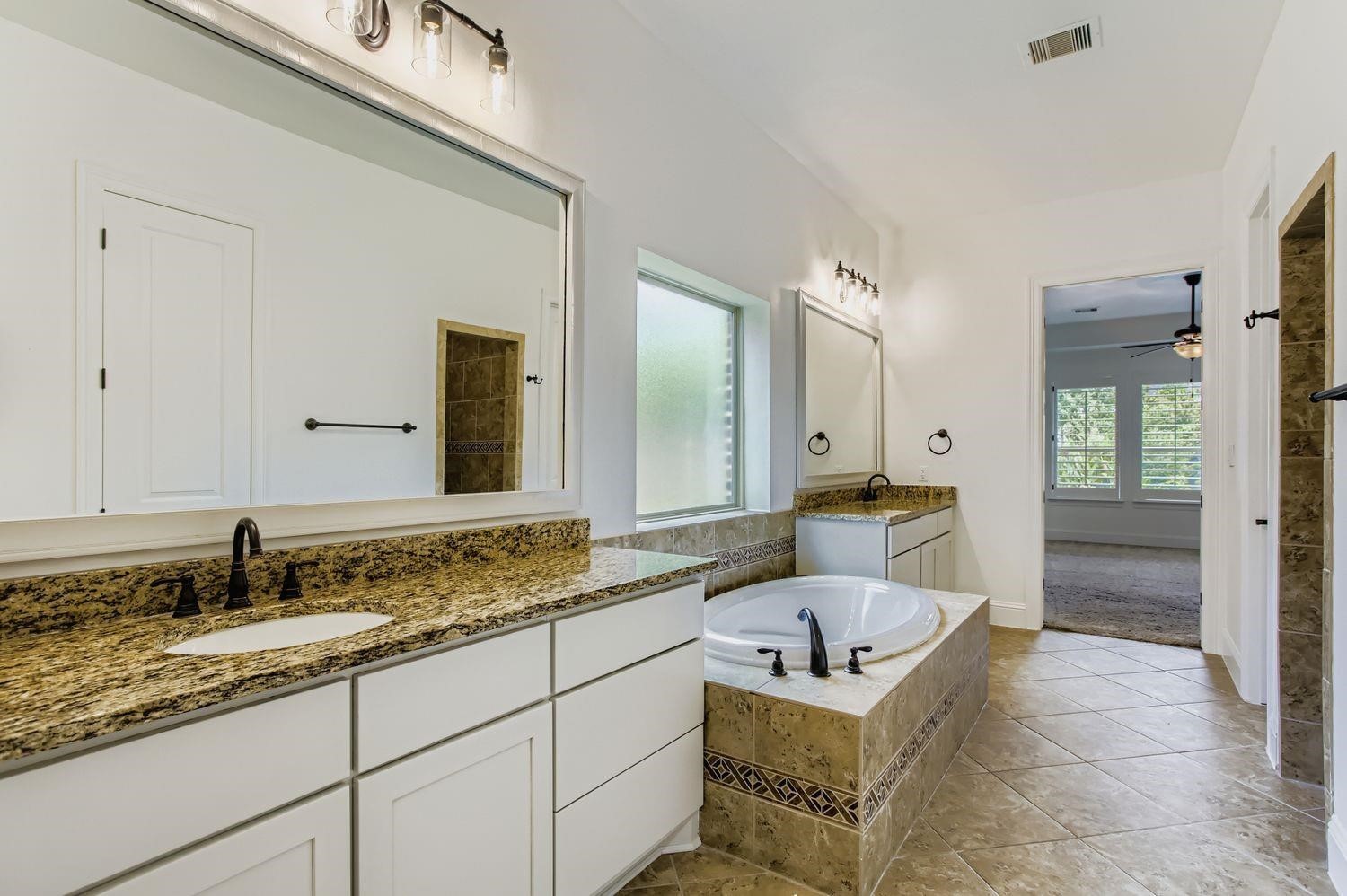 6 Freestone Stream Place The Woodlands, TX 77389 - Photo 30 of 50 a bathroom with a sink and a mirror