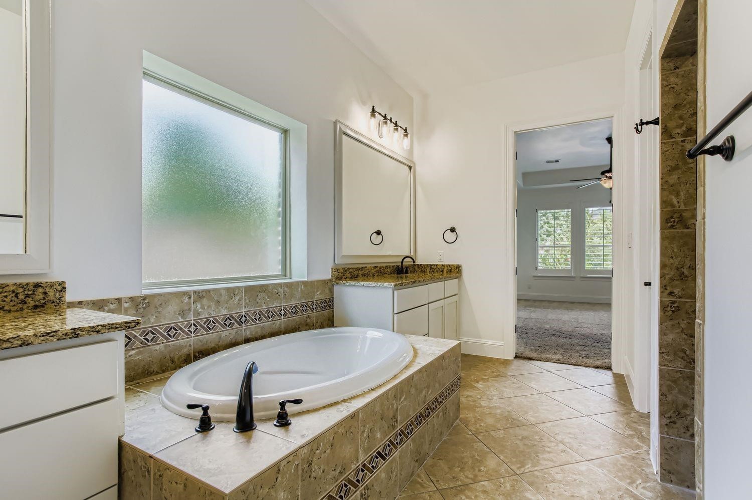 6 Freestone Stream Place The Woodlands, TX 77389 - Photo 31 of 50 a bathroom with a sink and a mirror