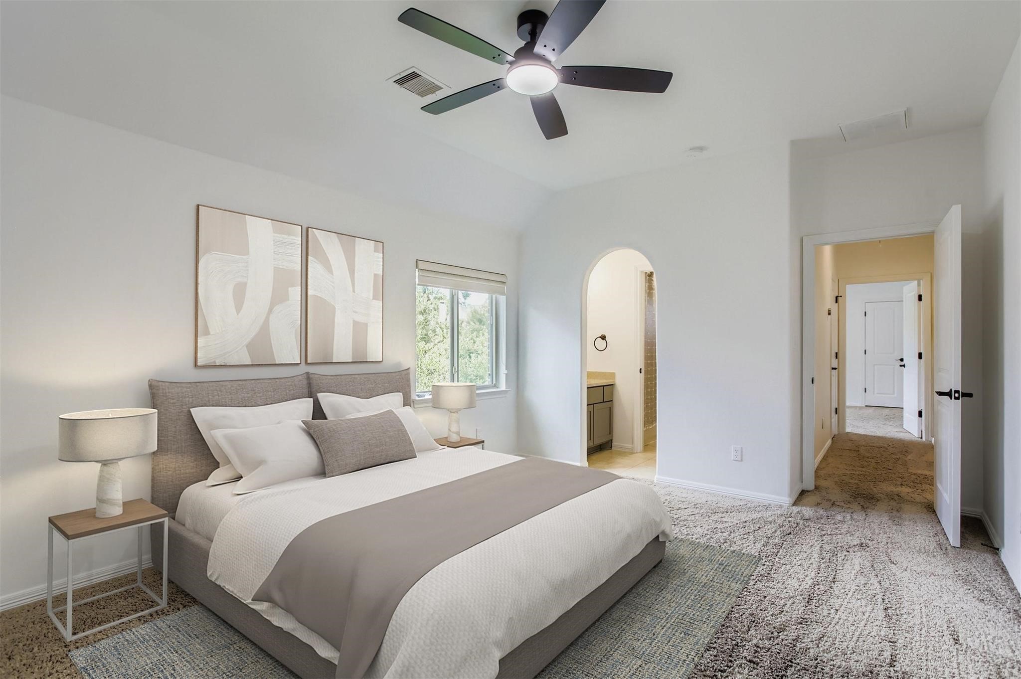 6 Freestone Stream Place The Woodlands, TX 77389 - Photo 33 of 50 a bedroom with a large bed and a chandelier