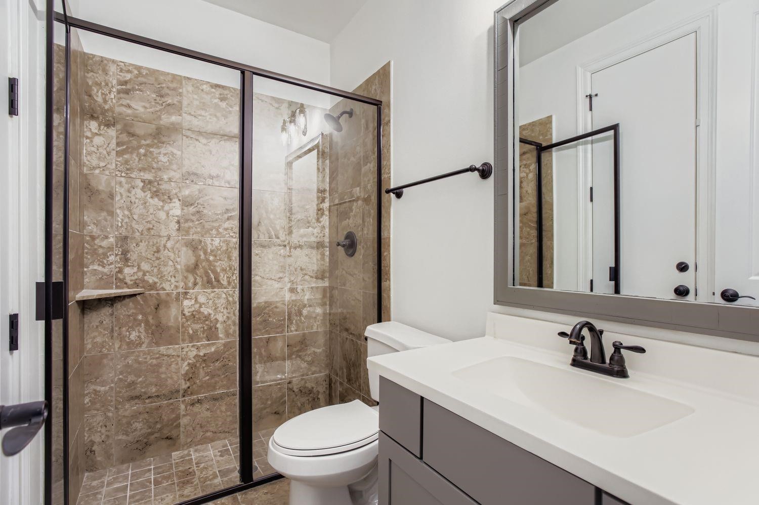 6 Freestone Stream Place The Woodlands, TX 77389 - Photo 35 of 50 a bathroom with a sink toilet and shower