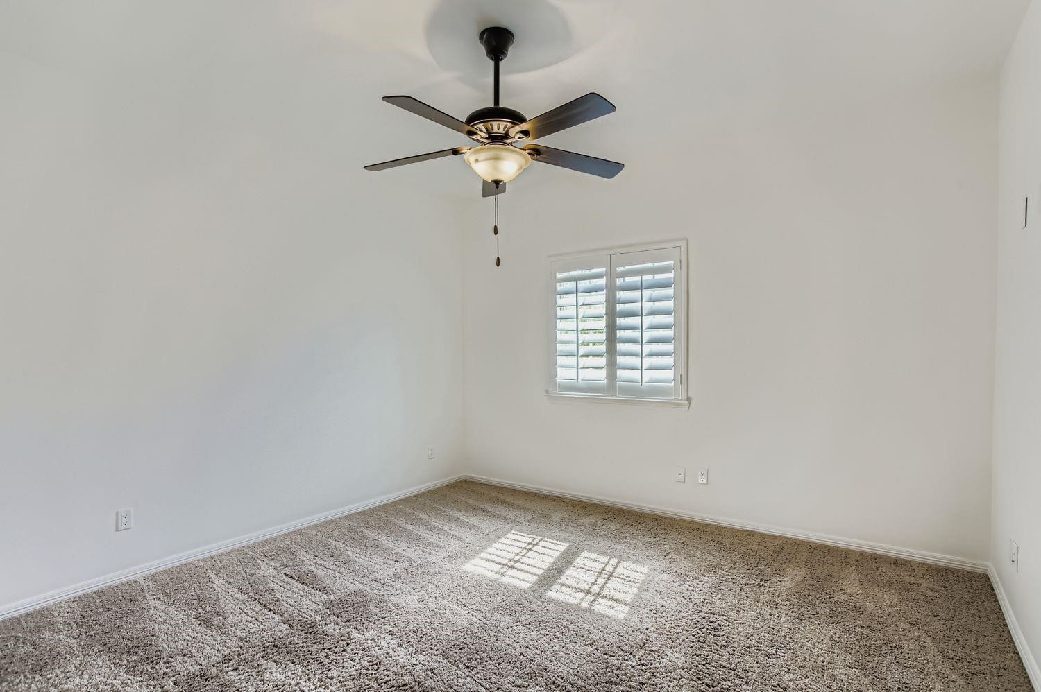 6 Freestone Stream Place The Woodlands, TX 77389 - Photo 37 of 50 a view of a room with a window and a fan