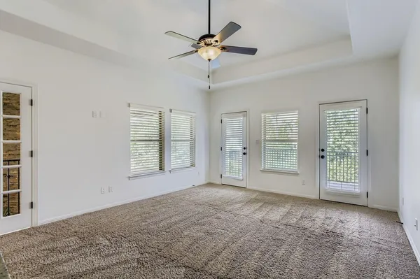 a living room with furniture and a projector screen