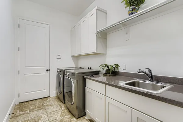 an aerial view of a house with outdoor space