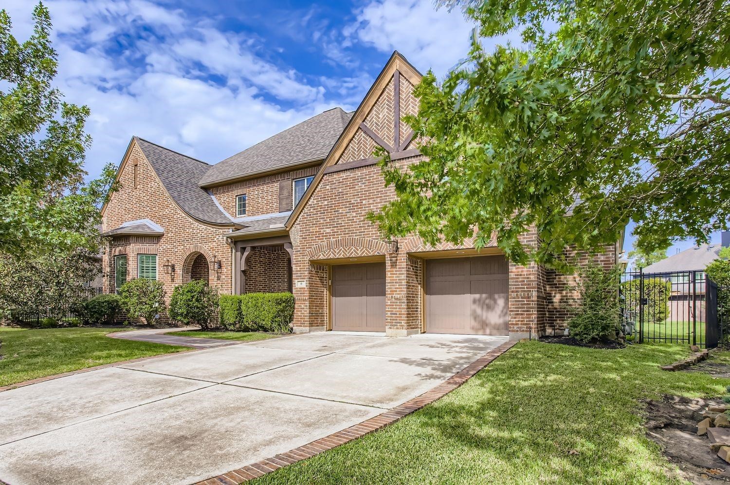 6 Freestone Stream Place The Woodlands, TX 77389 - Photo 5 of 50 a front view of house with yard and green space