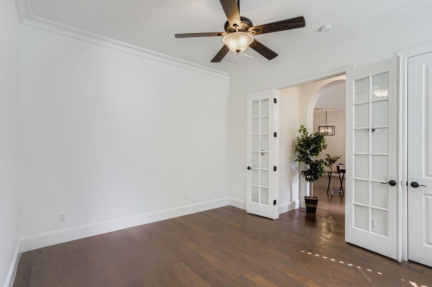 6 Freestone Stream Place The Woodlands, TX 77389 - Photo 10 of 50 wooden floor in an empty room with a window