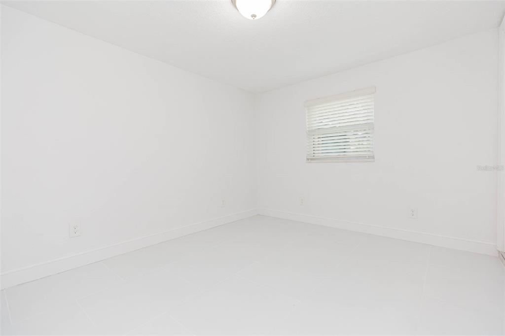 118 West Sligh Avenue Tampa, FL 33604 - Photo 16 of 20 a view of an empty room with a window