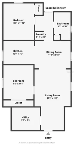 a tree in front of a house next to a yard