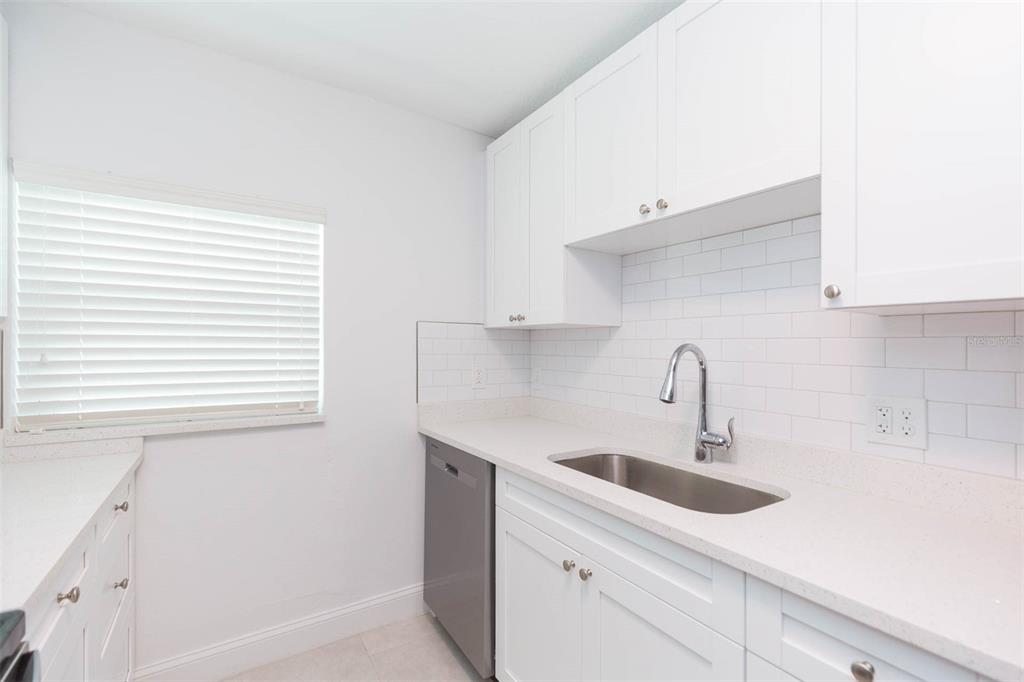 118 West Sligh Avenue Tampa, FL 33604 - Photo 6 of 20 a kitchen with a sink and cabinets