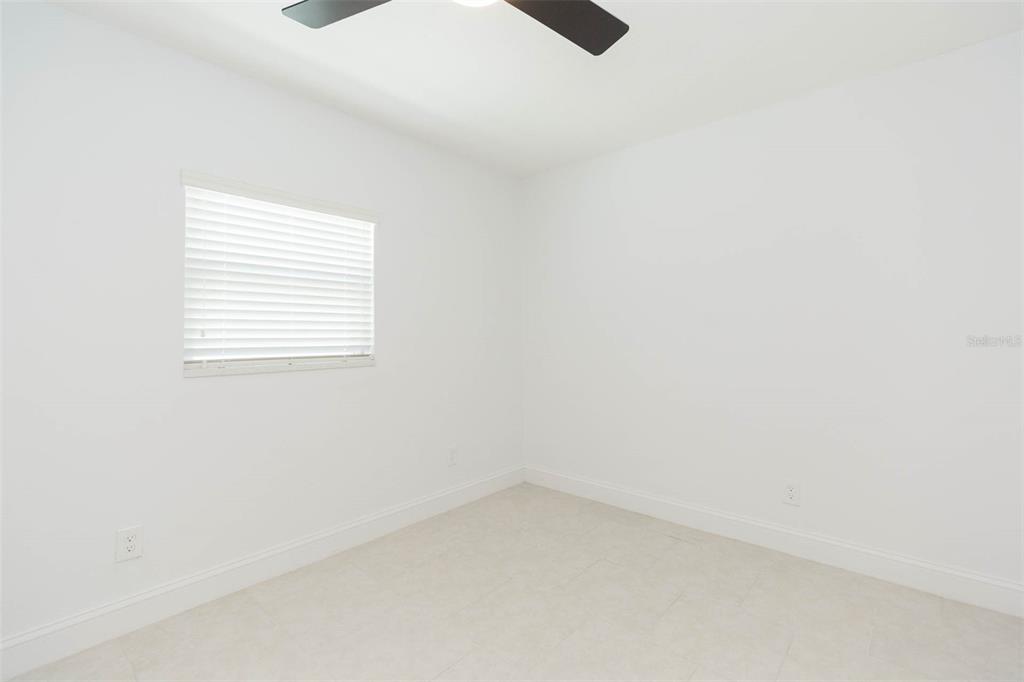 118 West Sligh Avenue Tampa, FL 33604 - Photo 9 of 20 a view of an empty room with a window